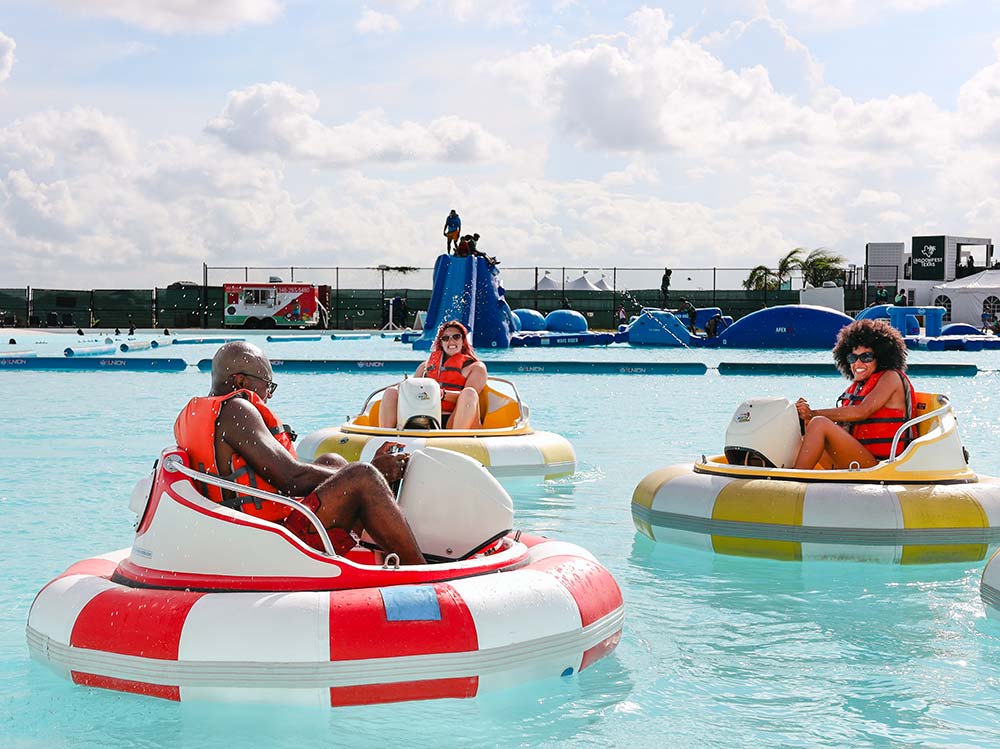 Guests riding bumper boats at Lagoonfest Texas